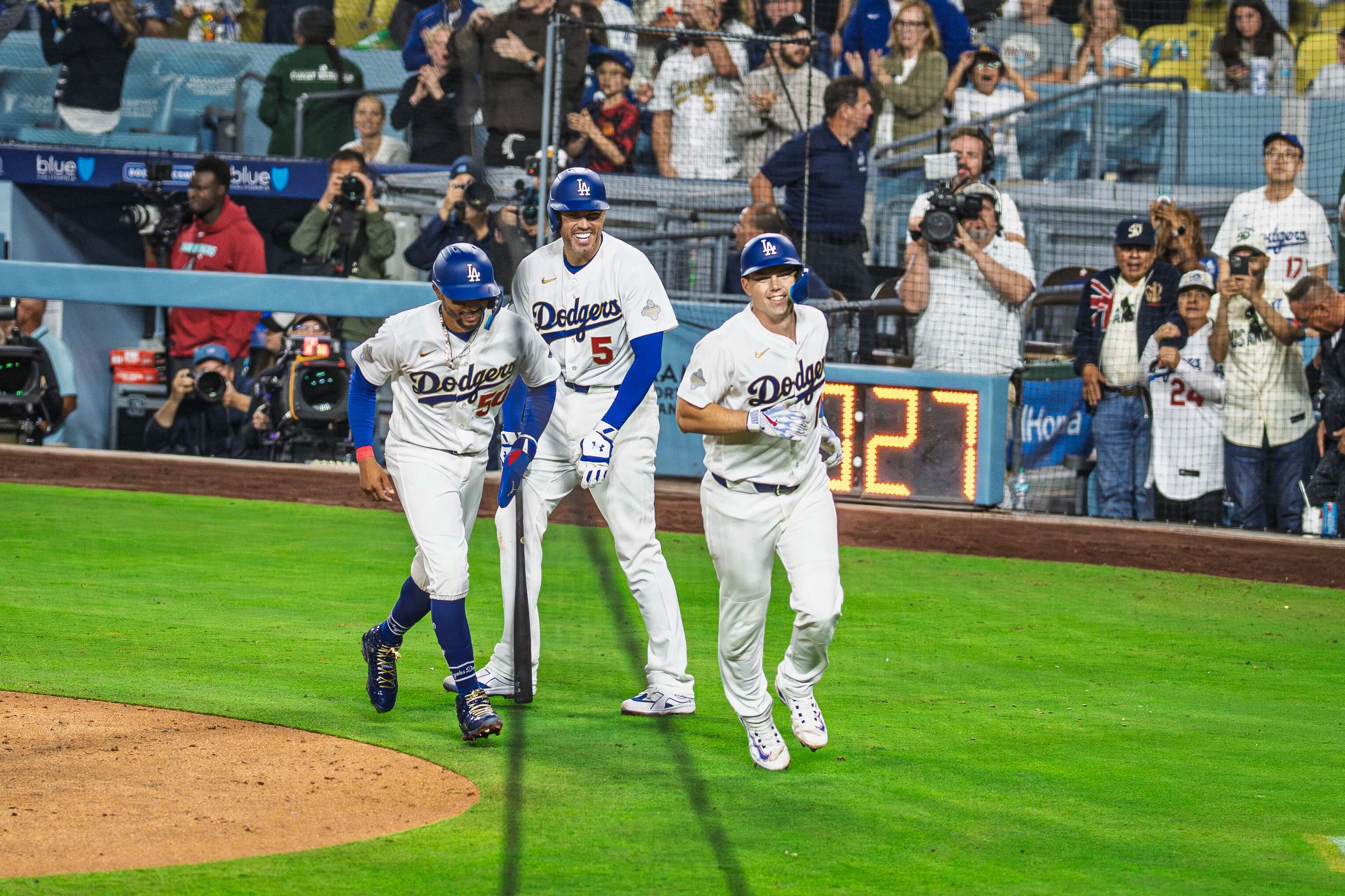 Dodgers players celebrating after a run